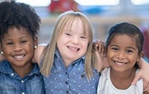 Children smiling and looking at the camera