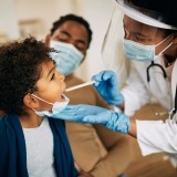 A child being examined by a doctor.