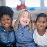 Children smiling and looking at the camera